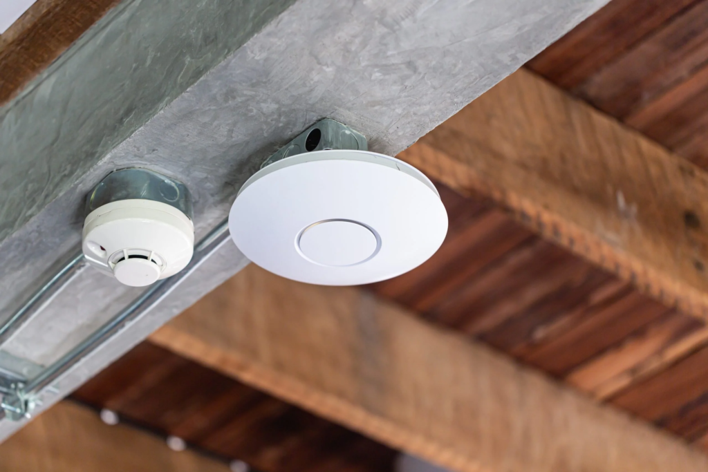 Ceiling-mounted Wi-Fi access point installed by FortiFi