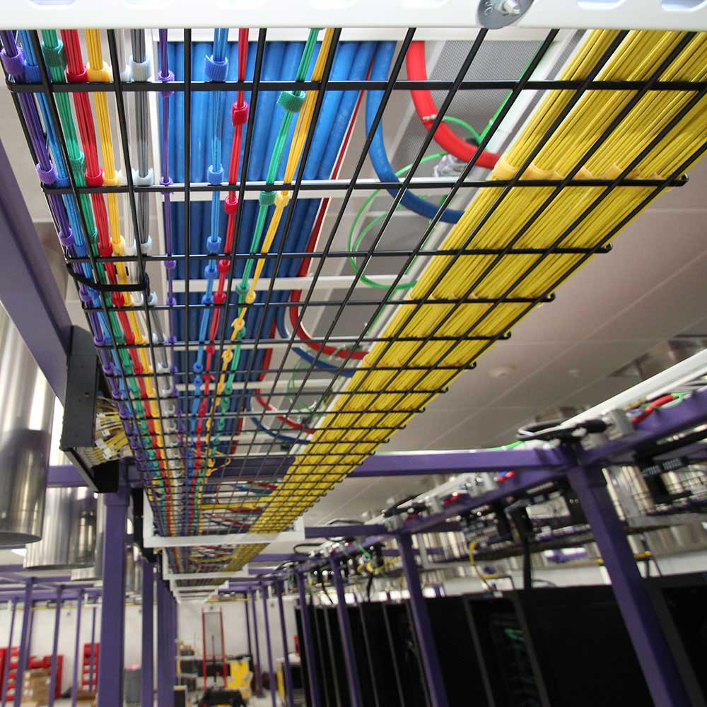 Cat6 Ethernet cables terminated in a network rack